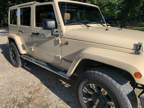 2011 Jeep Wrangler Unlimited for sale at BARROW MOTORS in Campbell TX