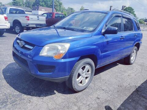2009 Kia Sportage for sale at The Car Cove, LLC in Muncie IN