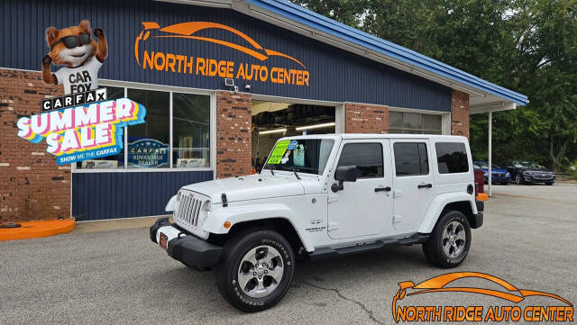 2016 Jeep Wrangler Unlimited for sale at North Ridge Auto Center LLC in Madison, OH