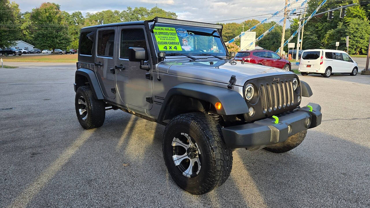 2014 Jeep Wrangler Unlimited for sale at North Ridge Auto Center LLC in Madison, OH