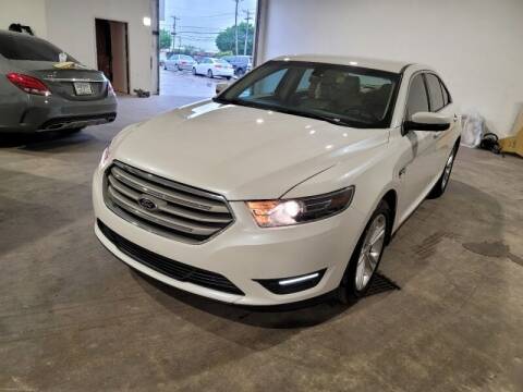 2014 Ford Taurus for sale at A & J Enterprises in Dallas TX