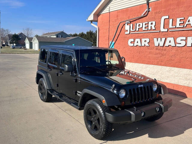 2014 Jeep Wrangler Unlimited for sale at Illinois Auto Wholesalers in Tolono, IL