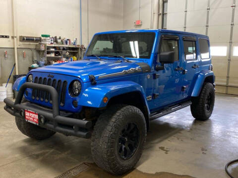 2014 Jeep Wrangler Unlimited for sale at DAN PORTER MOTORS in Dickinson ND