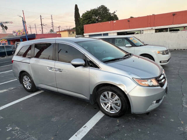 2014 Honda Odyssey for sale at Unique Auto Sales, Inc. in Bell, CA