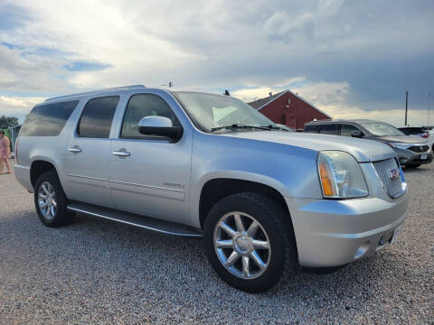 2012 GMC Yukon XL for sale at BERKENKOTTER MOTORS in Brighton CO