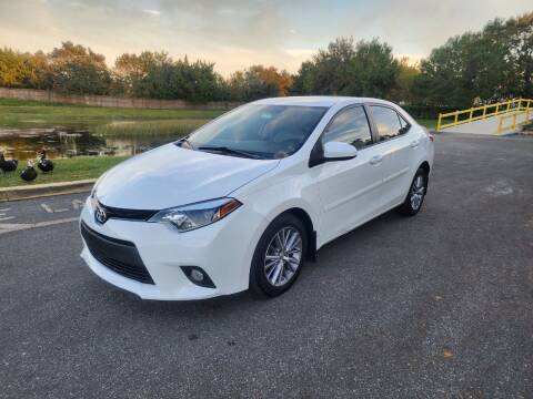 2014 Toyota Corolla for sale at Carcoin Auto Sales in Orlando FL