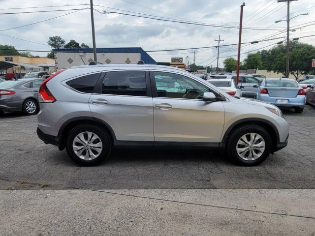 2014 Honda CR-V for sale at DAGO'S AUTO SALES LLC in Dalton, GA