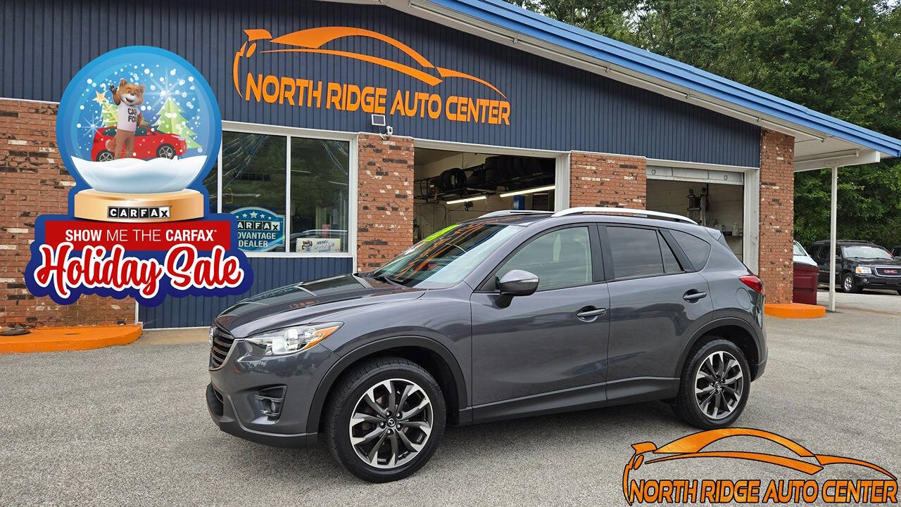 2016 Mazda CX-5 for sale at North Ridge Auto Center LLC in Madison, OH