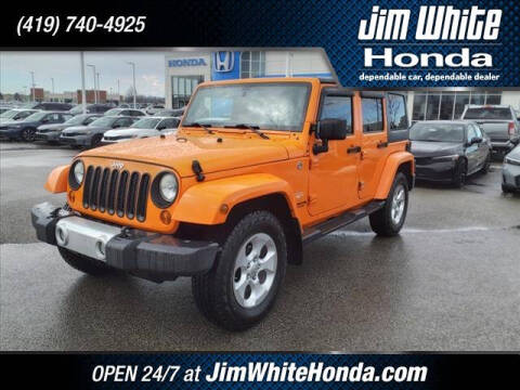 2013 Jeep Wrangler Unlimited for sale at The Credit Miracle Network Team at Jim White Honda in Maumee OH