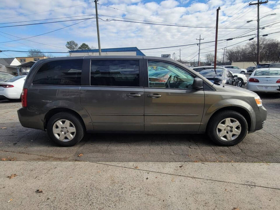 2010 Dodge Grand Caravan for sale at DAGO'S AUTO SALES LLC in Dalton, GA