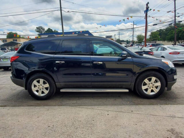 2012 Chevrolet Traverse for sale at DAGO'S AUTO SALES LLC in Dalton, GA