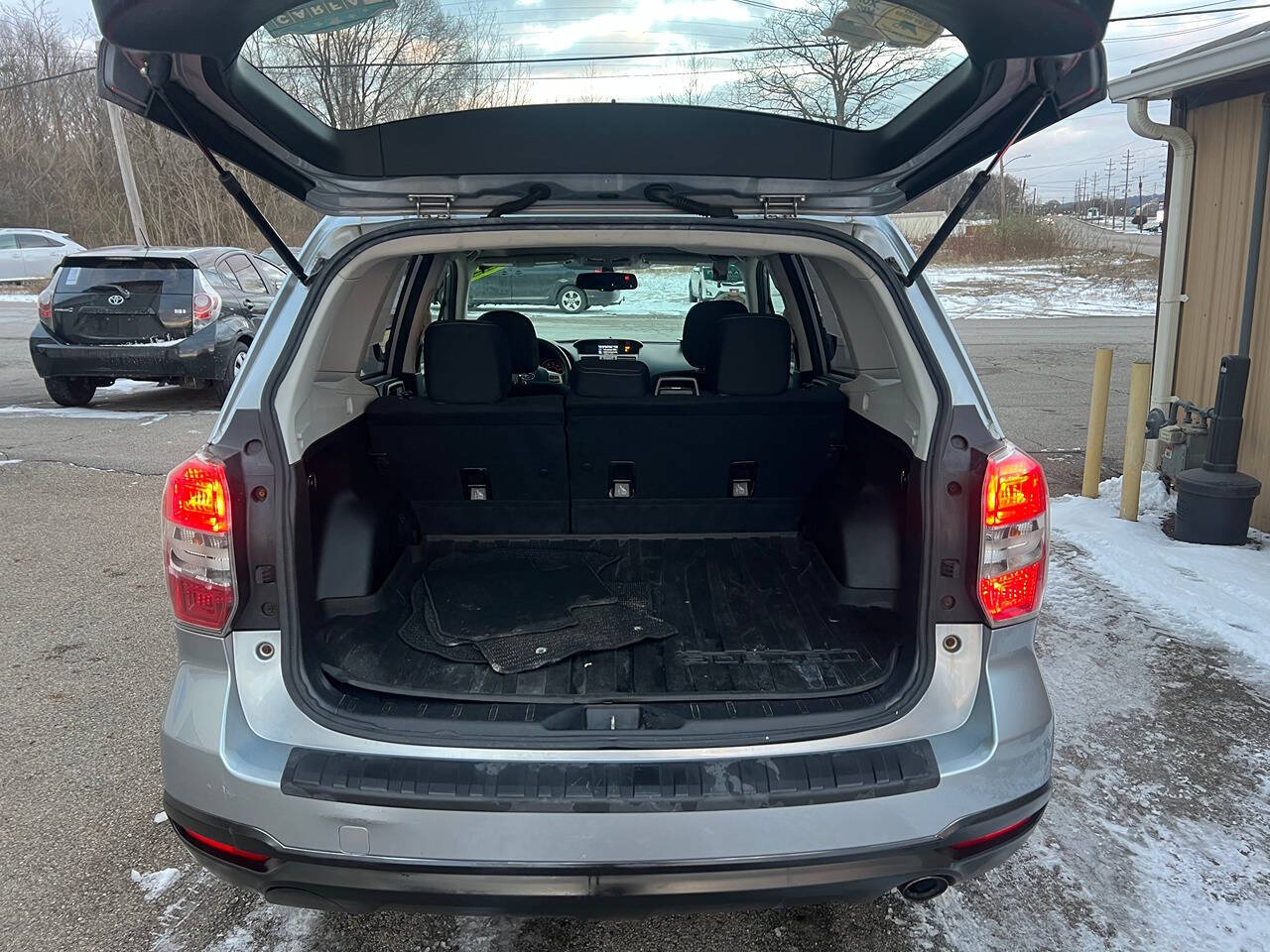 2014 Subaru Forester for sale at BNM AUTO GROUP in GIRARD, OH