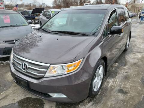 2012 Honda Odyssey for sale at Howe's Auto Sales LLC - Howe's Auto Sales in Lowell MA