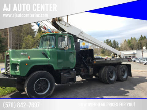 1988 Mack DM690S for sale at AJ AUTO CENTER in Covington PA