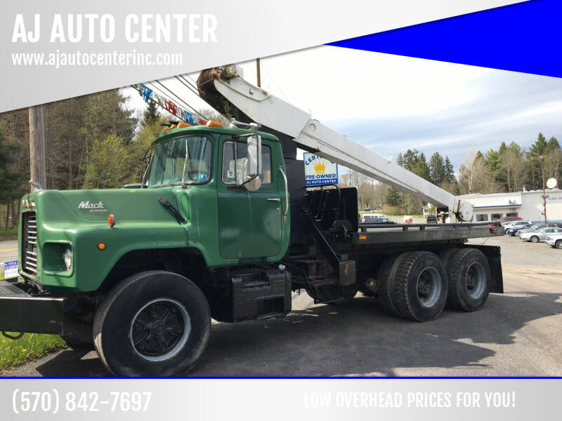 1988 Mack DM690S for sale at AJ AUTO CENTER in Covington PA