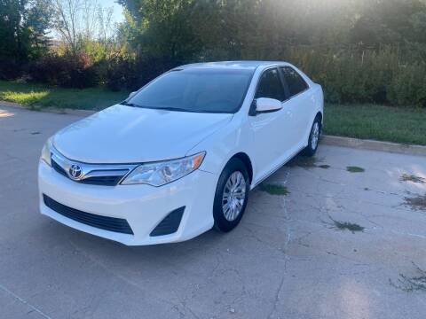 2014 Toyota Camry for sale at QUEST MOTORS in Englewood CO