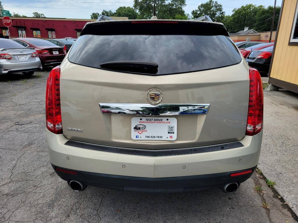 2011 Cadillac SRX for sale at DAGO'S AUTO SALES LLC in Dalton, GA