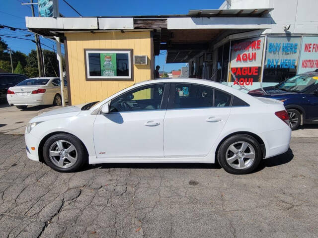 2013 Chevrolet Cruze for sale at DAGO'S AUTO SALES LLC in Dalton, GA