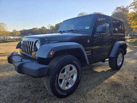 2011 Jeep Wrangler for sale at Rombaugh's Auto Sales in Battle Creek MI