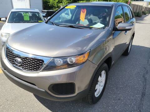 2011 Kia Sorento for sale at Howe's Auto Sales in Lowell MA