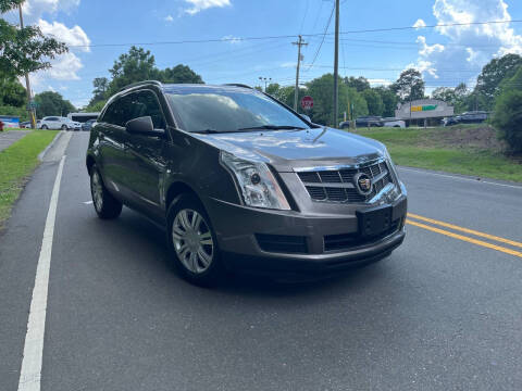 2012 Cadillac SRX for sale at THE AUTO FINDERS in Durham NC