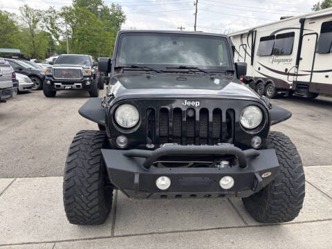 2014 Jeep Wrangler Unlimited for sale at AUTOS PLUS AUTO SALES in Hamilton OH