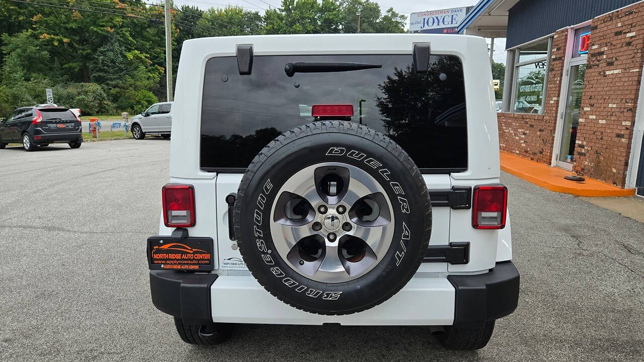 2016 Jeep Wrangler Unlimited for sale at North Ridge Auto Center LLC in Madison, OH