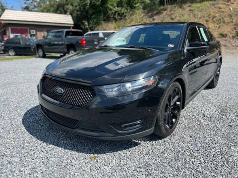 2015 Ford Taurus for sale at Booher Motor Company in Marion VA