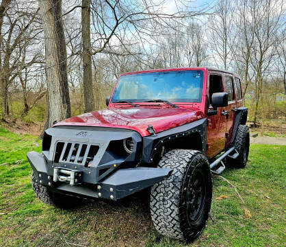 2013 Jeep Wrangler Unlimited for sale at GOLDEN RULE AUTO in Newark OH