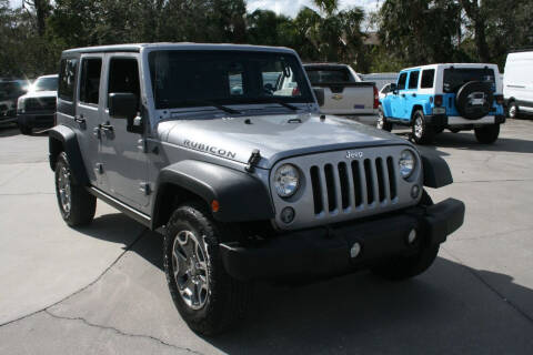 2015 Jeep Wrangler Unlimited for sale at Mike's Trucks & Cars in Port Orange FL