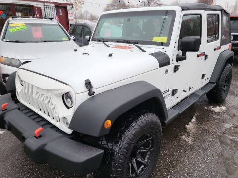 2015 Jeep Wrangler Unlimited for sale at Howe's Auto Sales in Lowell MA