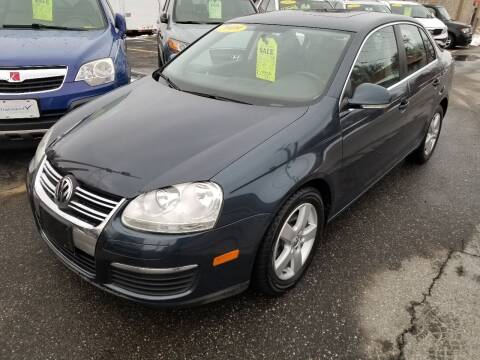 2009 Volkswagen Jetta for sale at Howe's Auto Sales in Lowell MA