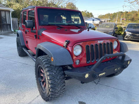 2014 Jeep Wrangler Unlimited for sale at Auto Class in Alabaster AL