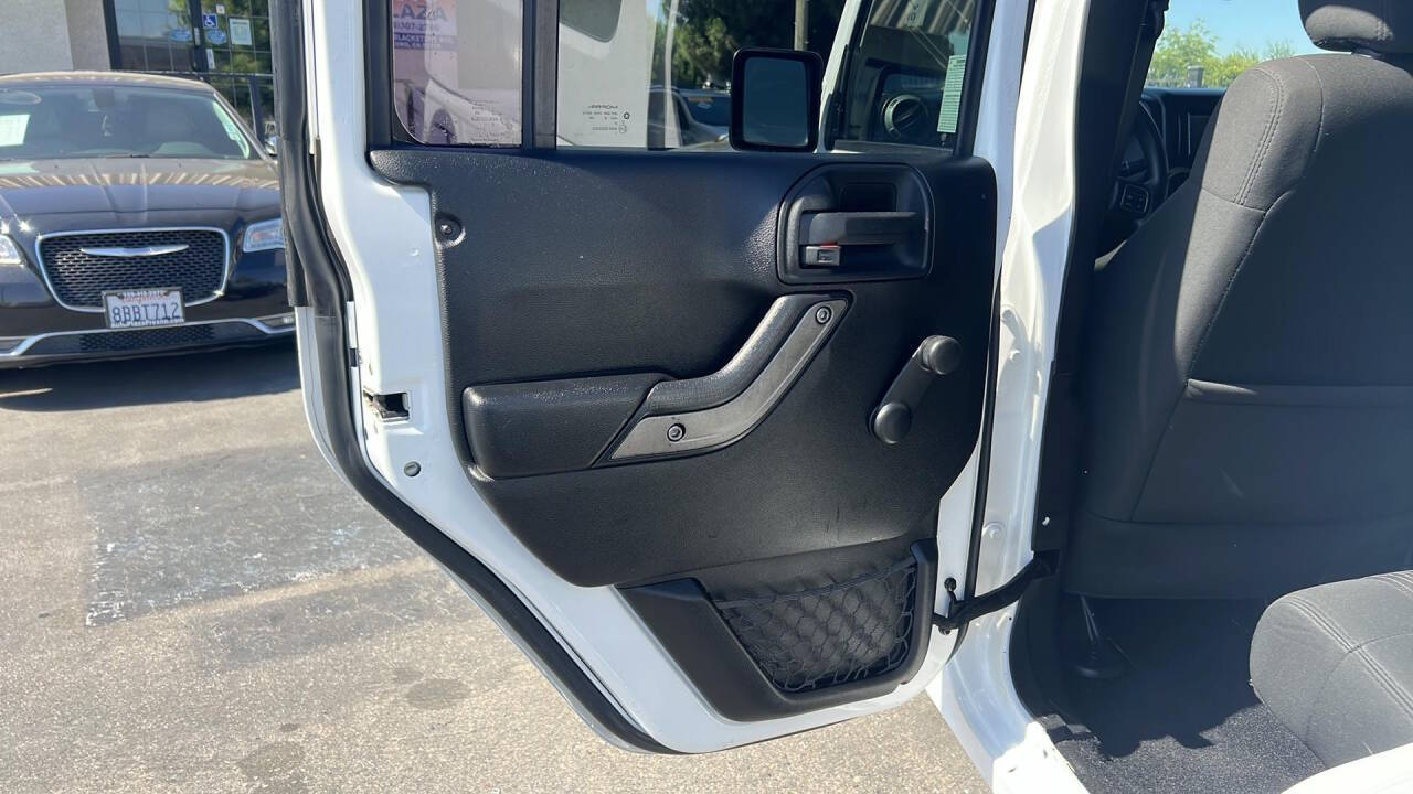 2012 Jeep Wrangler Unlimited for sale at Auto Plaza in Fresno, CA