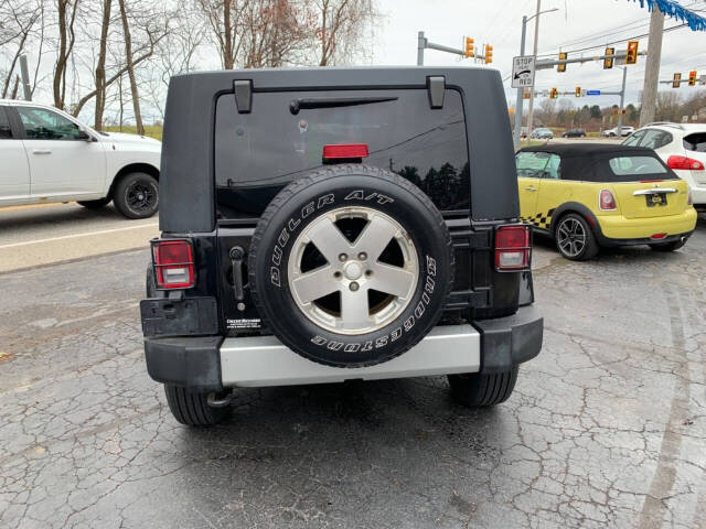 2009 Jeep Wrangler Unlimited for sale at Chuckie Bizzarro's Fleetwing Auto in Erie, PA