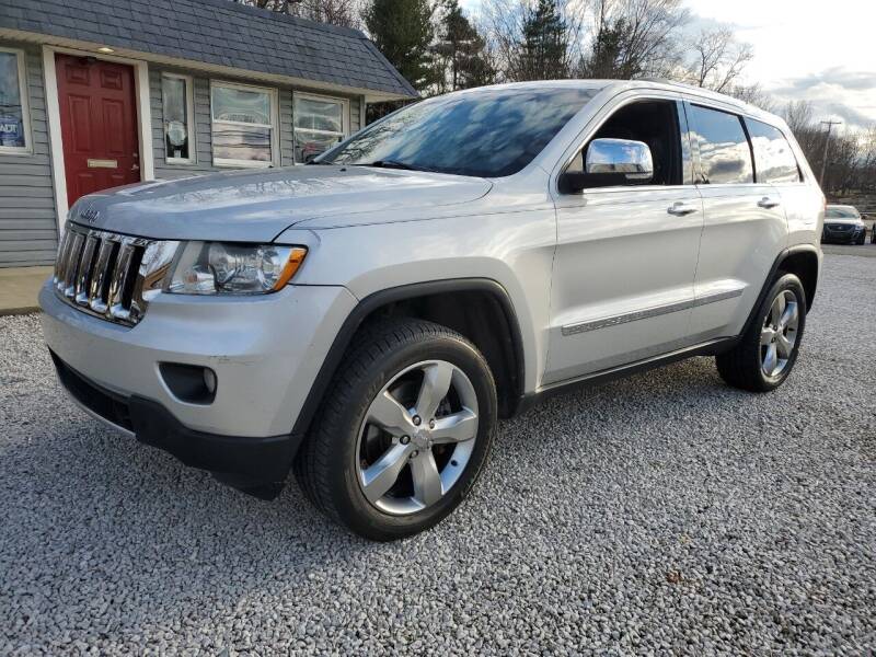 2011 Jeep Grand Cherokee for sale at BARTON AUTOMOTIVE GROUP LLC in Alliance OH