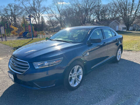 2016 Ford Taurus for sale at Triangle Auto Sales in Elgin IL