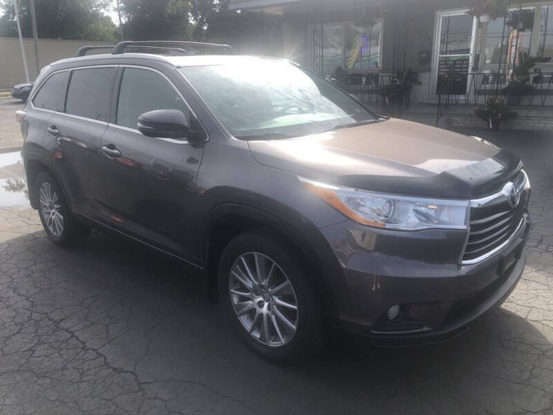 2014 Toyota Highlander for sale at Tradewind Car Co in Muskegon MI