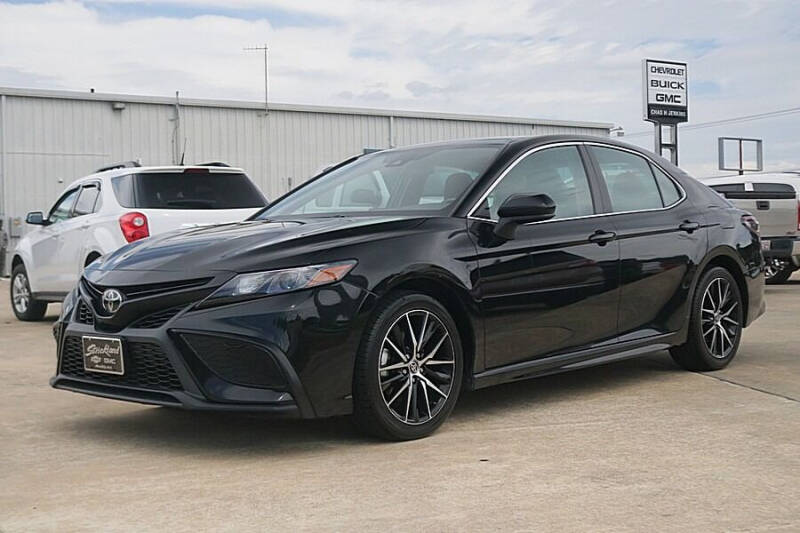 2021 Toyota Camry for sale at STRICKLAND AUTO GROUP INC in Ahoskie NC