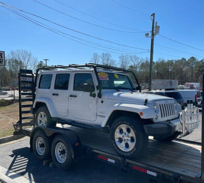 2014 Jeep Wrangler Unlimited for sale at Paul Wallace Inc Auto Sales in Chester VA