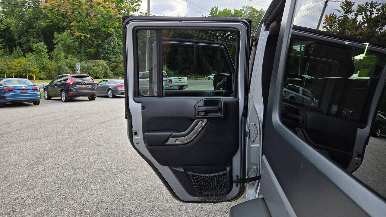 2014 Jeep Wrangler Unlimited for sale at North Ridge Auto Center LLC in Madison, OH