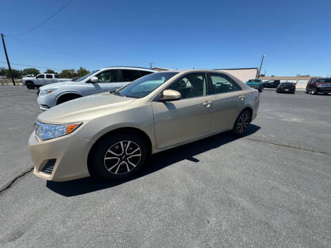 2012 Toyota Camry for sale at CHINO'S AUTO SALES LLC in Fallon NV