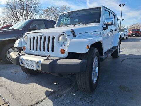 2012 Jeep Wrangler Unlimited for sale at Village Auto Outlet in Milan IL