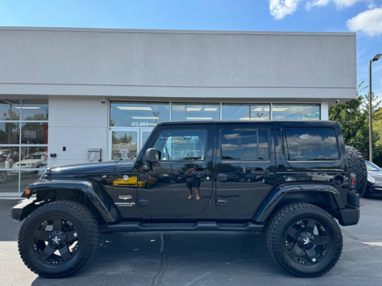 2014 Jeep Wrangler Unlimited for sale at Opus Motorcars in Utica, MI