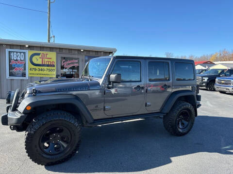 2014 Jeep Wrangler Unlimited for sale at CarTime in Rogers AR