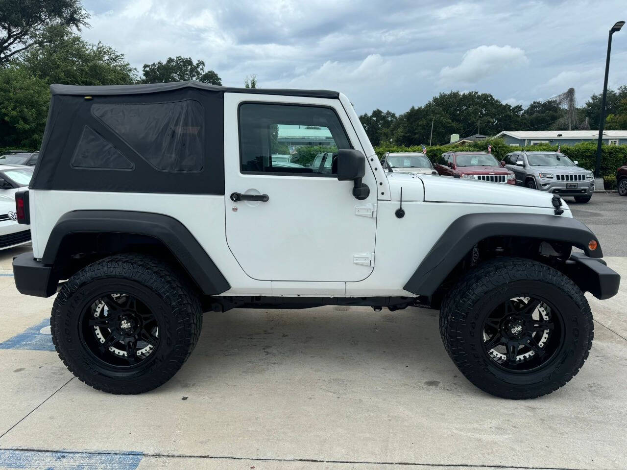 2014 Jeep Wrangler for sale at DJA Autos Center in Orlando, FL