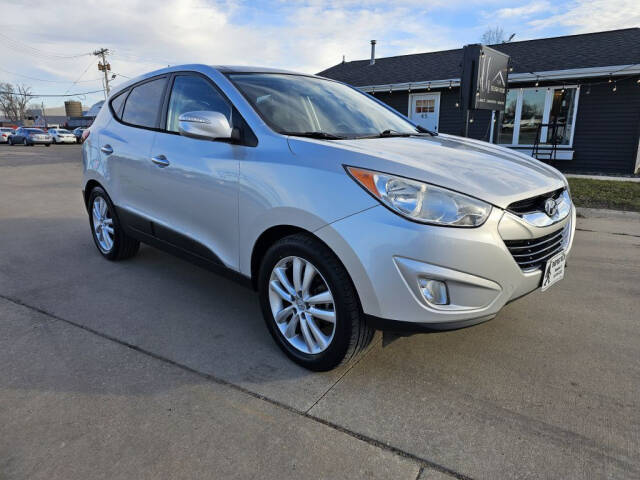 2011 Hyundai TUCSON for sale at Bigfoot Auto in Hiawatha, IA