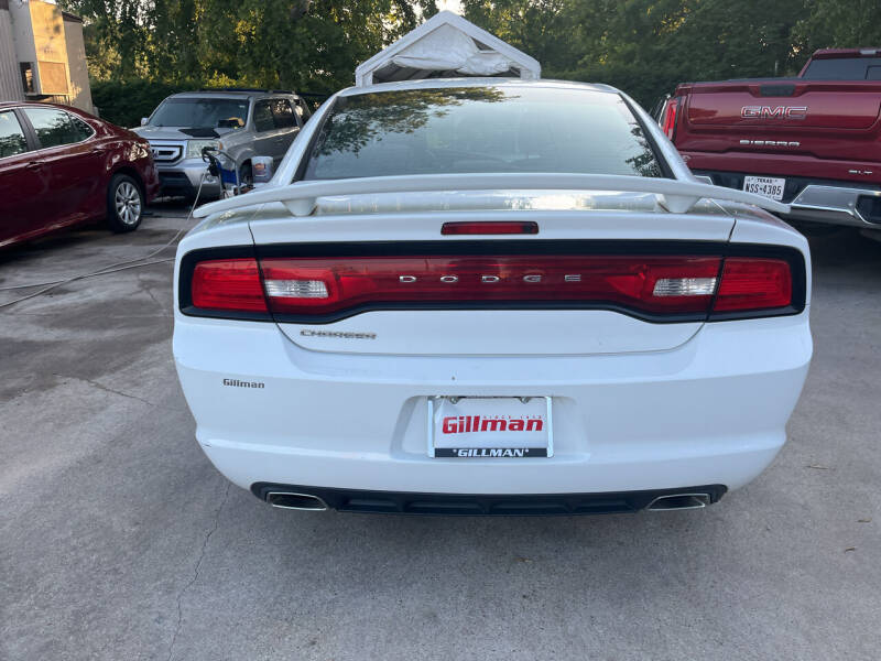 2014 Dodge Charger for sale at Memo's Auto Sales in Houston TX