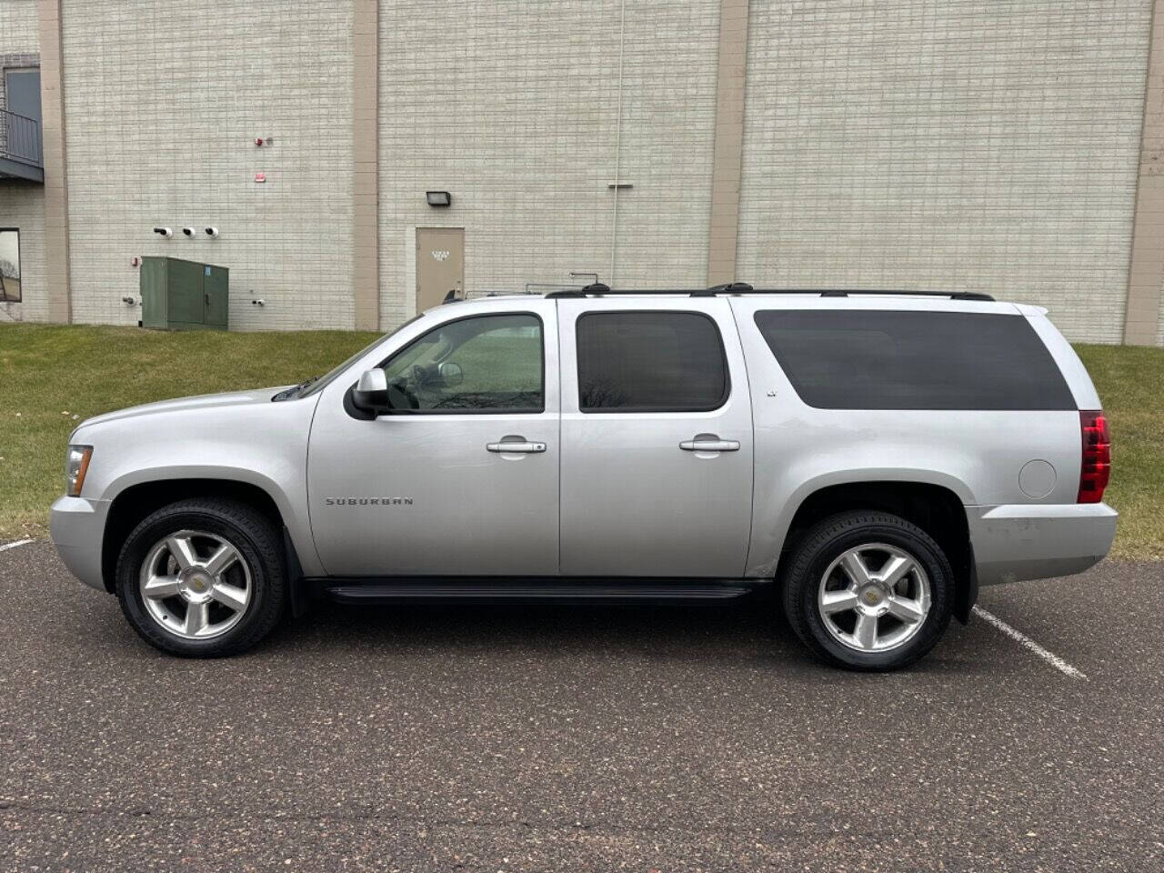 2011 Chevrolet Suburban for sale at JUST AUTOS in MINNEAPOLIS, MN