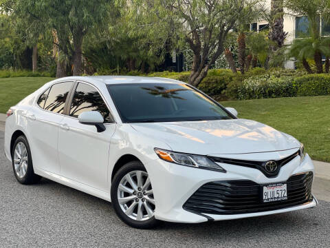 2019 Toyota Camry for sale at MILLENNIUM MOTORS in Van Nuys CA